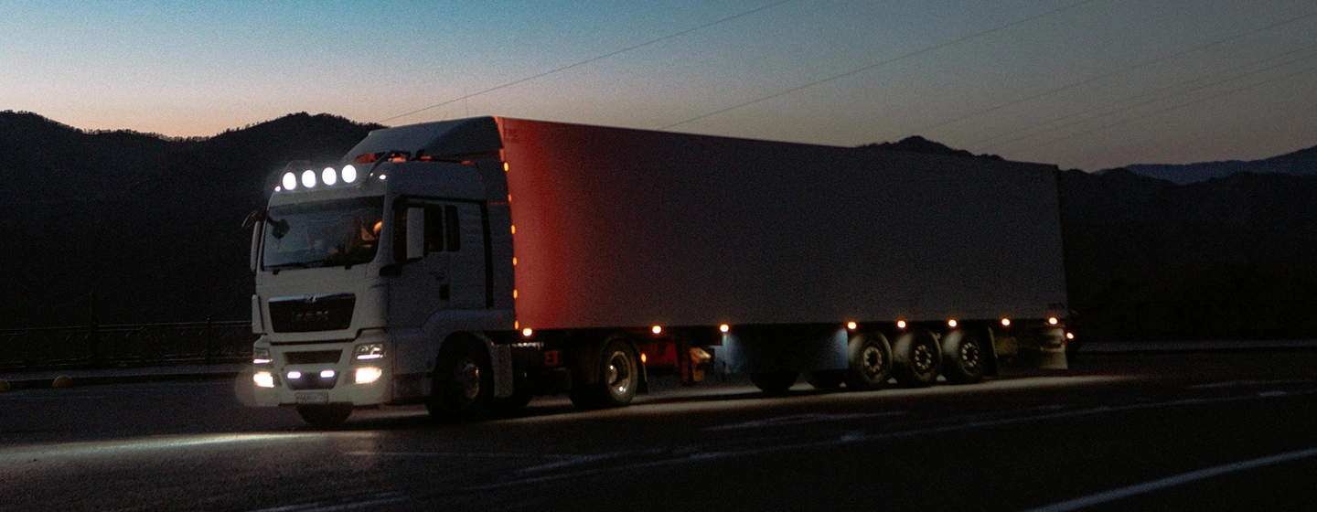 Transportation truck on highway at dusk